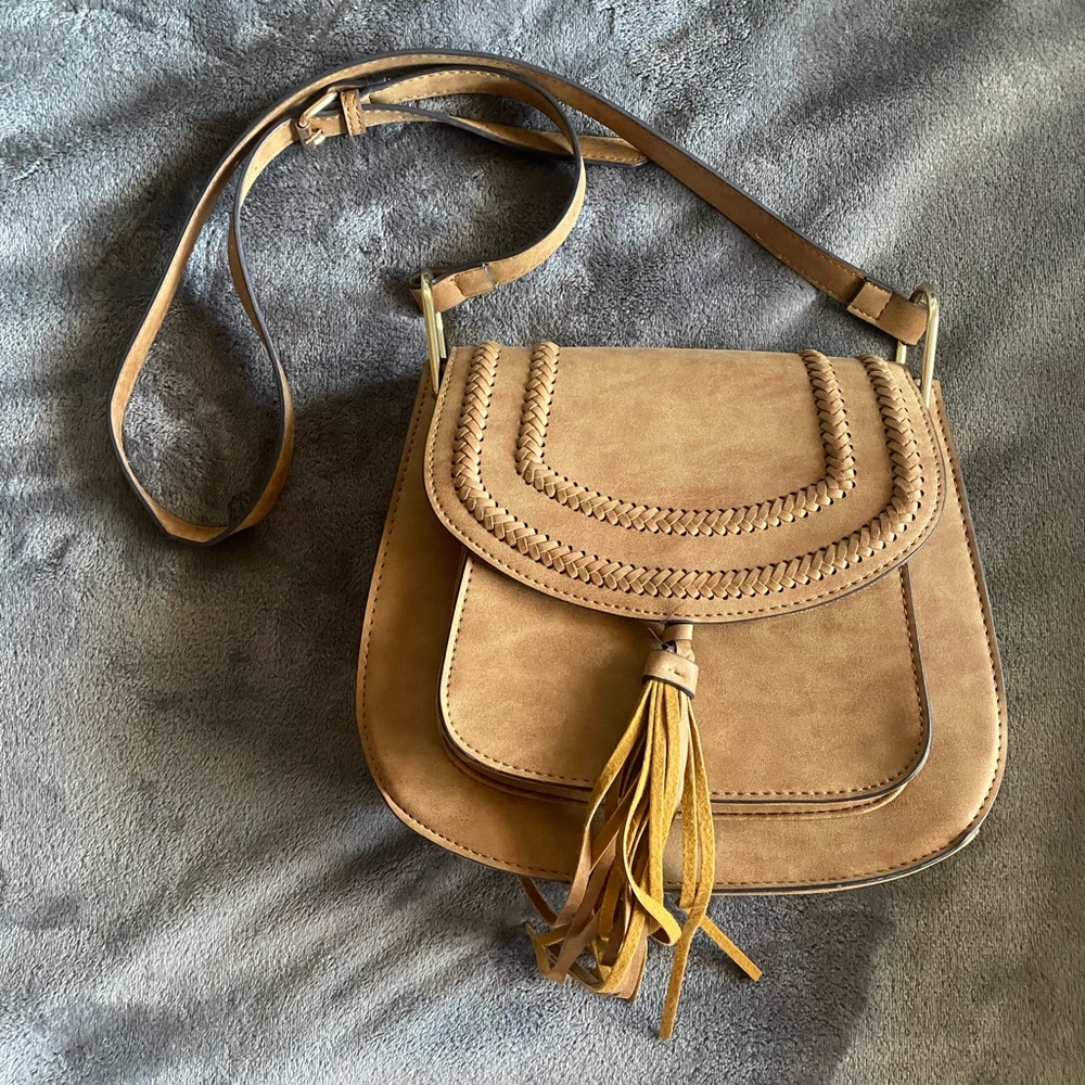 Western style purse with five pockets. Purchased from local boutique